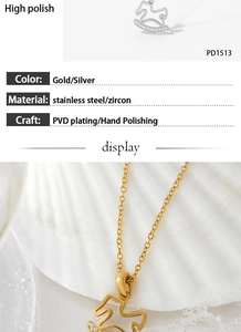 Detailed view of horse pendant with zircon inlay in gold and silver stainless steel