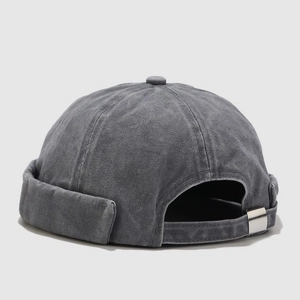 Detail view of the vintage washed grey cotton beanie with adjustable metal buckle strap