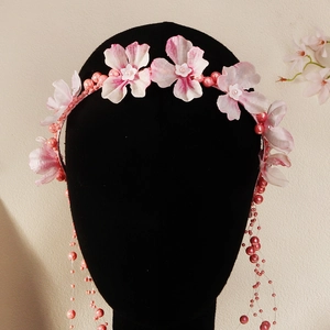 Detailed pink floral headband with cascading pearl tassels for wedding party hair styling