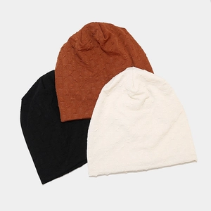 Unisex bubble textured knit beanies in black, brown and off-white colors set