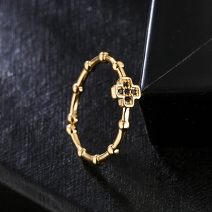 18K gold plated copper cross ring with black micro-inlaid zircons on black leather