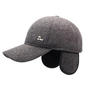 Deep grey winter baseball cap with ear flaps and metal logo at 45-degree angle