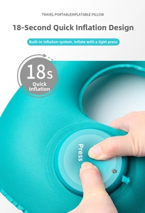 Detail of lake blue travel pillow showing the manual press-to-inflate pump system