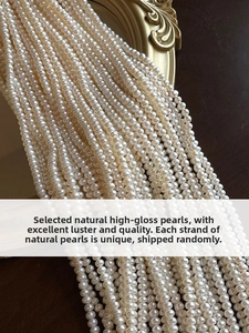 Close-up of white natural freshwater pearls with high luster on a vintage gold frame