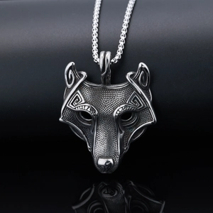 Macro shot of Viking wolf head pendant with Celtic patterns on a square box chain