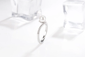 Detailed macro view of S925 silver ring featuring a white pearl and zircon accents