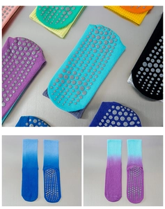 Detail of anti-slip silicone grip dots on gradient yoga socks with a mid-tube knit design