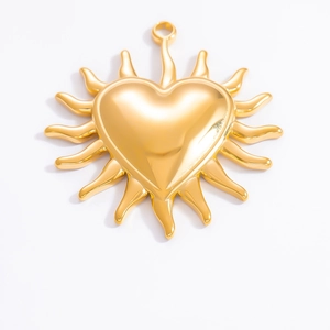 Detail of 18k gold plated sunburst heart pendant with polished finish and hanging loop