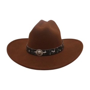 Detail of a brown felt cowboy hat featuring a silver lion head buckle and patterned band