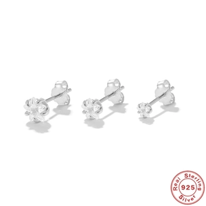 Detailed view of three different sized silver flower stud earrings in 925 sterling silver