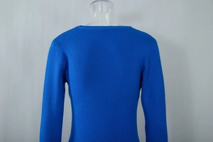 Close-up of royal blue ribbed knit texture and round neckline of a fitted dress