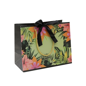 Floral gift bag with tropical prints, black silk ribbon bow and gold rope handles