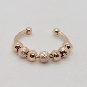 Rose gold rotatable bead ring with polished and frosted beads in stainless steel
