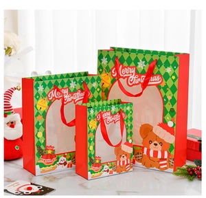 Three sizes of red and green Christmas gift bags with window and Merry Christmas print