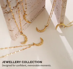 Detailed macro view of gold hammered crescent moon pendants with textured ripple surface