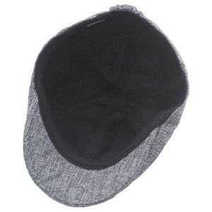 Detail shot showing the black lining and reinforced stitching of the dark gray linen cap