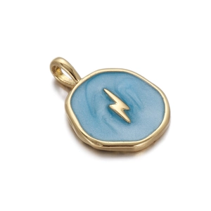Macro shot of gold lightning bolt pendant with light blue enamel inlay and round gold loop