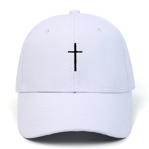 White baseball cap featuring a black embroidered cross on the front with a minimalist design