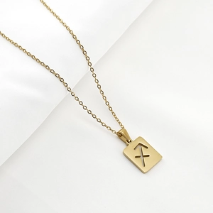 Detailed view of Sagittarius sign on rectangular hollow gold stainless steel pendant