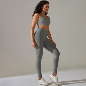 Detail of grey seamless knit yoga set featuring a sports bra and high-waisted leggings