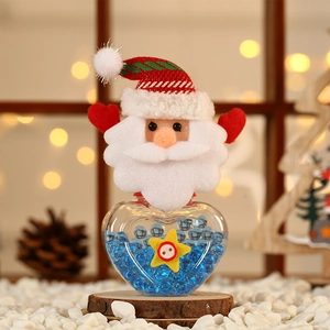 Macro detail of heart-shaped Christmas candy jar with Santa felt topper and blue beads