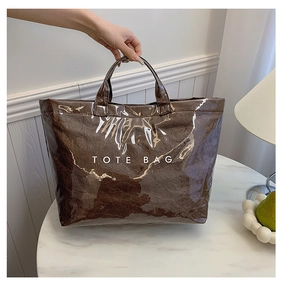 Detail of waterproof brown Tyvek tote bag with white lettering in a home setting