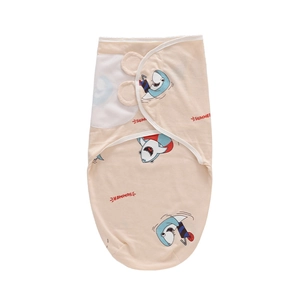 Detail of baby sleeping bag with shark pattern and SUMMER text on beige fabric