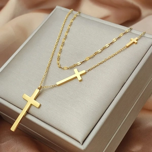 Elegant 18K gold double layer titanium steel cross pendant necklace on silk backdrop