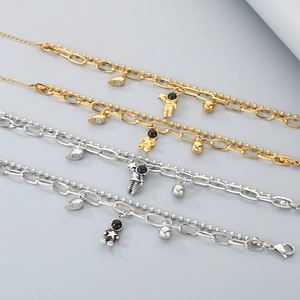 Matching astronaut heart magnet bracelets in gold and silver finish for couples