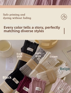 Detailed flat lay of cotton crew socks with ruffle edges in various pastel and neutral colors