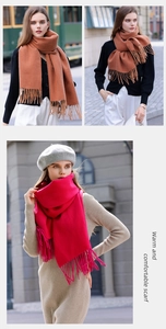 Street style shot of model wearing a caramel and rose pink scarf with tassel detail