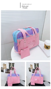 Detail of pink and purple ita bag showing the heart-shaped clear window and handle