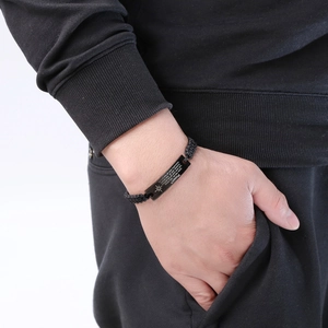 Handwoven black rope bracelet with engraved black stainless steel bar for men