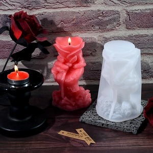 Detail of DIY skeleton hand with rose candle mold showing silicone texture and finished art