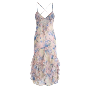 Floral print summer maxi dress with spaghetti straps and ruffles on a white background