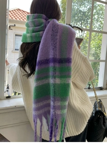 Detail of soft purple and green rainbow check scarf with long fringe tassels
