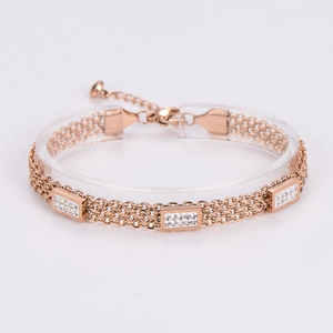 Detail of rose gold multi-layer bracelet featuring three rectangular zircon settings