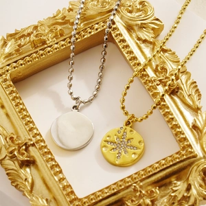 North Star pendant necklaces in gold and silver finish with crystal inside a vintage frame