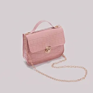 Pink crocodile pattern crossbody bag with golden chain strap and top handle for women