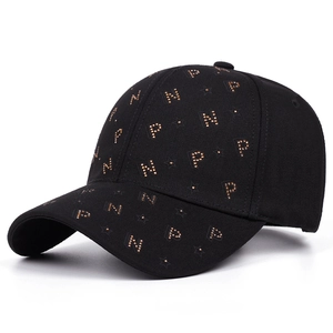 Black cotton baseball cap with gold rivet PN star pattern in a 45-degree profile view