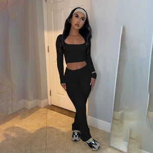 Detail of black long sleeve square neck crop top and matching yoga pants set