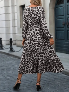 Rear view of long sleeve leopard print midi dress with ruffled hem and waist tie detail