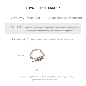 Detail view of pink and white resin floral pearl necklace with weight and size specifications