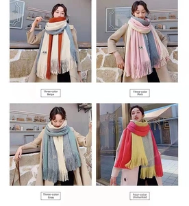 Detail view of multi-color knitted scarves with long tassels for winter warmth