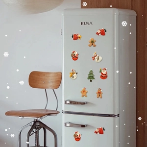 Festive 3D Christmas magnets set with Santa and Gingerbread Man on a white fridge