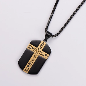 Detail of black military dog tag necklace with a textured gold cross on a steel pendant
