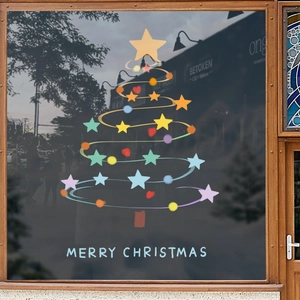 Christmas tree window sticker with colorful stars and Merry Christmas lettering on shop glass