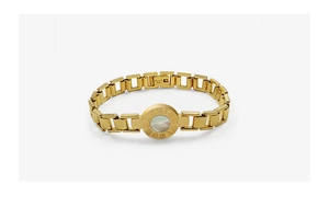 Detailed close-up of gold titanium bracelet with Roman numerals and mother of pearl inlay