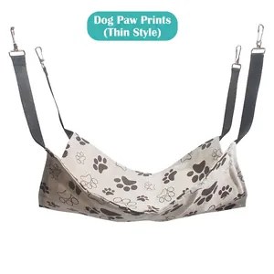 Detail view of thin breathable cat hammock with brown paw prints and metal hooks