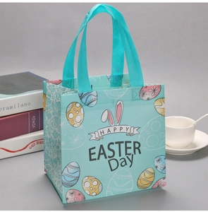 Detailed view of the light blue Easter tote bag with bunny ears and colorful eggs
